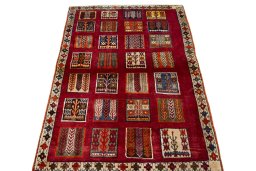 Surface texture of 2000s Persian Gabbeh rug with natural Wool and intricate pattern