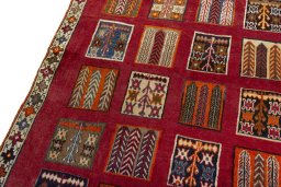 Backside of handmade 2000s Persian Gabbeh rug showing knot structure and weave density