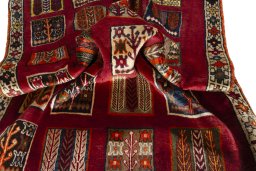 Full view of 2000s Persian Gabbeh rug from Iran / Persia, 175 × 114 cm in Red tones