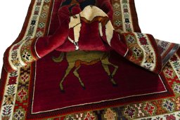 Corner detail of 2000s Persian Gabbeh rug showing border pattern and Wool pile