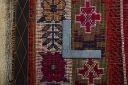 Close-up detail of 2000s Persian Gabbeh rug from Iran / Persia showing Wool weave