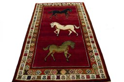Surface texture of 2000s Persian Gabbeh rug with natural Wool and intricate pattern