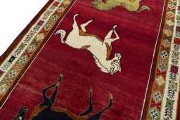 Backside of handmade 2000s Persian Gabbeh rug showing knot structure and weave density