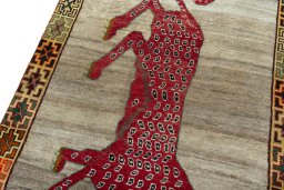 Backside of handmade 2000s Persian Gabbeh rug showing knot structure and weave density