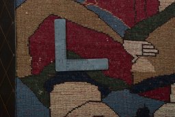 Backside of handmade 2000s Persian Gabbeh rug showing knot structure and weave density