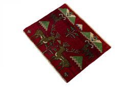 Corner detail of 2000s Persian Gabbeh rug showing border pattern and Wool pile
