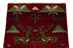 Surface texture of 2000s Persian Gabbeh rug with natural Wool and intricate pattern