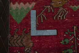 Backside of handmade 2000s Persian Gabbeh rug showing knot structure and weave density