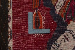 Backside of handmade 2000s Persian Gabbeh rug showing knot structure and weave density