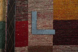 Close-up detail of 2000s Persian Gabbeh rug from Iran / Persia showing Wool weave
