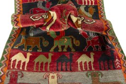 Corner detail of 2000s Persian Gabbeh rug showing border pattern and Wool pile