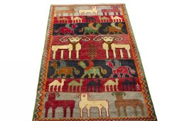 Surface texture of 2000s Persian Gabbeh rug with natural Wool and intricate pattern