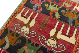 Backside of handmade 2000s Persian Gabbeh rug showing knot structure and weave density