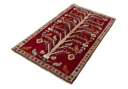 Corner detail of 2000s Persian Gabbeh rug showing border pattern and Wool pile