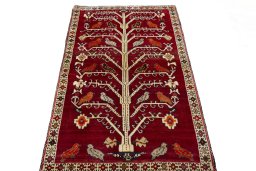 Surface texture of 2000s Persian Gabbeh rug with natural Wool and intricate pattern