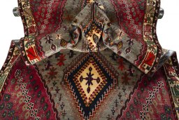 Corner detail of 2000s Persian Gabbeh rug showing border pattern and Wool pile