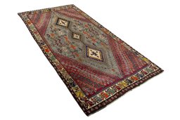 Close-up detail of 2000s Persian Gabbeh rug from Iran / Persia showing Wool weave
