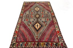 Surface texture of 2000s Persian Gabbeh rug with natural Wool and intricate pattern