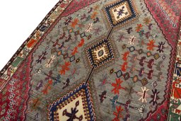 Backside of handmade 2000s Persian Gabbeh rug showing knot structure and weave density