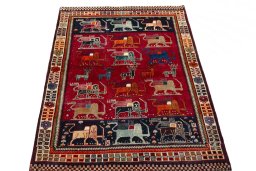 Surface texture of 2000s Persian Gabbeh rug with natural Wool and intricate pattern