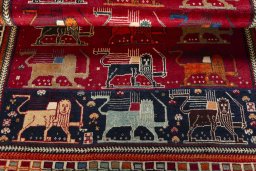 Full view of 2000s Persian Gabbeh rug from Iran / Persia, 185 × 132 cm in Red tones