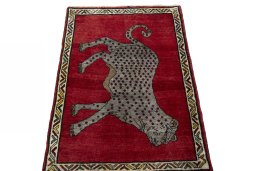 Surface texture of 2000s Persian Gabbeh rug with natural Wool and intricate pattern