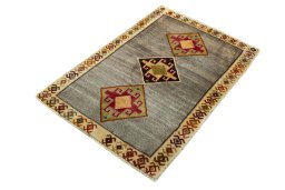 Corner detail of 2000s Persian Gabbeh rug showing border pattern and Wool pile