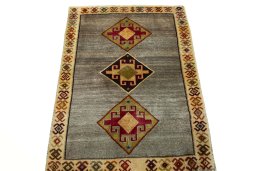 Surface texture of 2000s Persian Gabbeh rug with natural Wool and intricate pattern