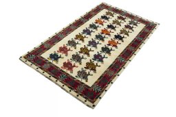 Corner detail of 2000s Persian Gabbeh rug showing border pattern and Wool pile