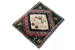 Corner detail of 2000s Persian Gabbeh rug showing border pattern and Wool pile