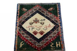 Surface texture of 2000s Persian Gabbeh rug with natural Wool and intricate pattern