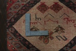 Backside of handmade 2000s Persian Gabbeh rug showing knot structure and weave density
