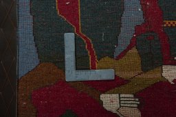 Backside of handmade 2000s Persian Gabbeh rug showing knot structure and weave density