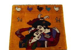 Surface texture of 2000s Persian Gabbeh rug with natural Wool and intricate pattern