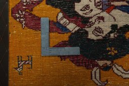 Backside of handmade 2000s Persian Gabbeh rug showing knot structure and weave density