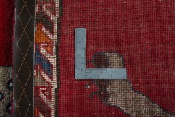 Corner detail of 2000s Persian Gabbeh rug showing border pattern and Wool pile