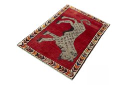 Corner detail of 2000s Persian Gabbeh rug showing border pattern and Wool pile