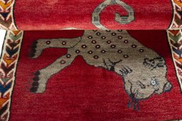 Full view of 2000s Persian Gabbeh rug from Iran / Persia, 125 × 86 cm in Red tones