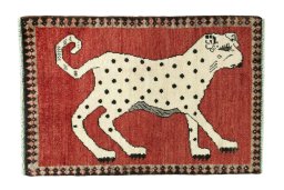Full view of 2000s Persian Gabbeh rug from Iran / Persia, 97 × 65 cm in Red tones
