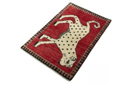 Corner detail of 2000s Persian Gabbeh rug showing border pattern and Wool pile