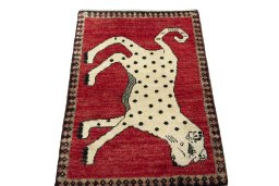Surface texture of 2000s Persian Gabbeh rug with natural Wool and intricate pattern
