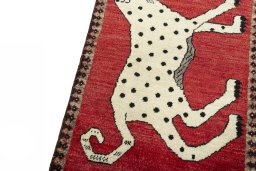 Backside of handmade 2000s Persian Gabbeh rug showing knot structure and weave density