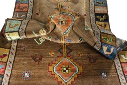 Corner detail of 2000s Persian Gabbeh rug showing border pattern and Wool pile