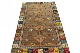 Surface texture of 2000s Persian Gabbeh rug with natural Wool and intricate pattern