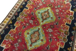 Backside of handmade 2000s Persian Gabbeh rug showing knot structure and weave density