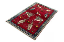 Corner detail of 2000s Persian Gabbeh rug showing border pattern and Wool pile