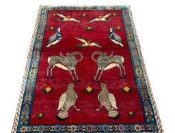 Surface texture of 2000s Persian Gabbeh rug with natural Wool and intricate pattern