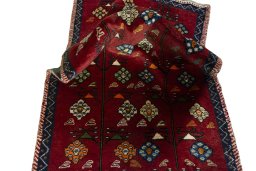 Corner detail of 2000s Persian Gabbeh rug showing border pattern and Wool pile