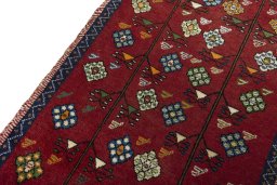 Backside of handmade 2000s Persian Gabbeh rug showing knot structure and weave density
