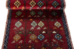 Full view of 2000s Persian Gabbeh rug from Iran / Persia, 143 × 74 cm in Red tones